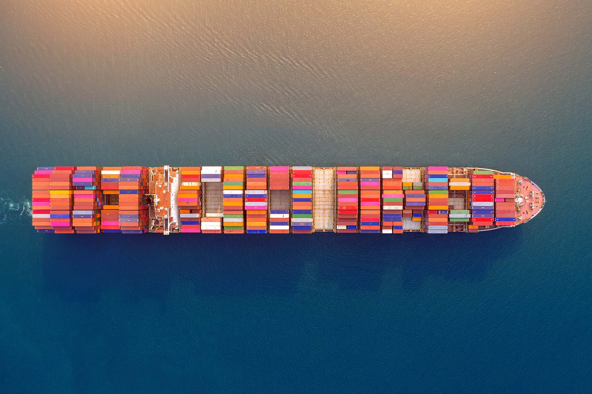 Aerial view of container cargo ship in sea.